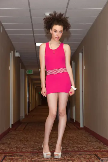 Tall Short-Haired Woman Strips Out of Her Dress in the Forest