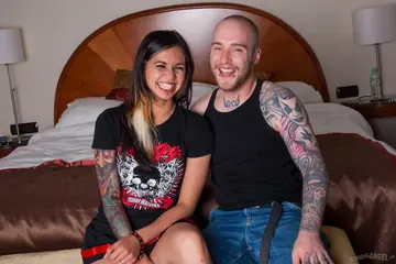Holly D – Tattooed Asian Brunette Services Two Cocks and Swallows Both Loads