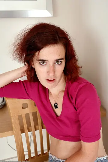 Short-Haired Redhead Pulls Aside Her Panties and Spreads Her Hairy Pussy