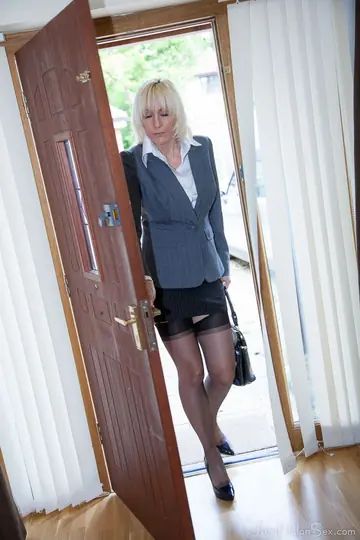 Jan Burton – British Blonde MILF Strips Out of Her Skirt and Stockings in the Office