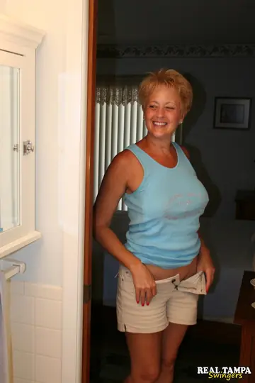 Tall Blonde MILF Gives a Soapy Handjob and Gets Cunnilingus in the Bathroom