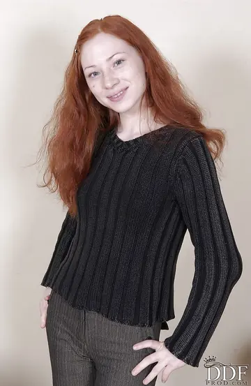 Slim Russian Redhead Undresses, Reveals Her Tattoos, and Spreads Her Legs