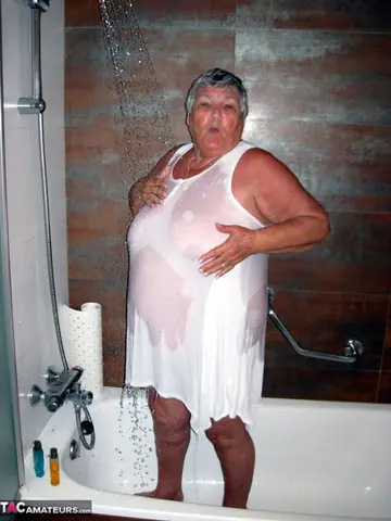 BBW MILF with Big Tits Blow-Dries Her Hair in the Bathroom