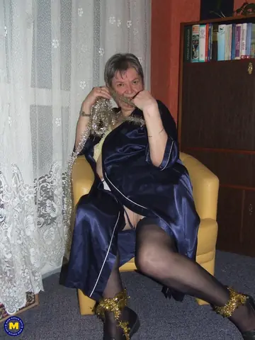 Mature European Woman Reveals Her Hairy Pussy in the Chair