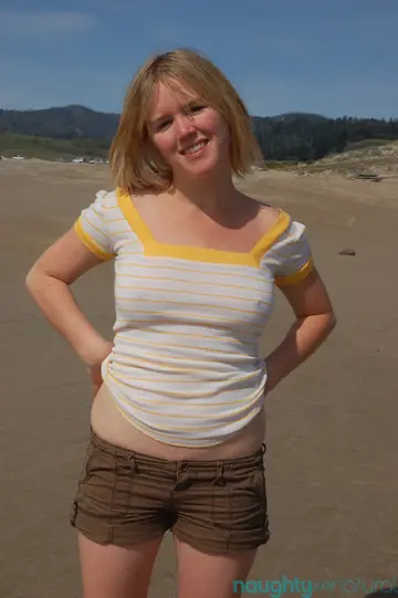 Eve Kisa – Short-Haired Blonde Amateur Shows Her Big Tits and Hairy Pussy on the Beach