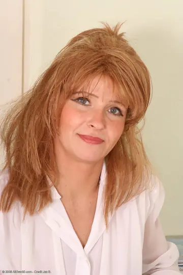 Redhead MILF Undresses to Reveal Her Big Tits and Spreads Her Pussy
