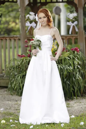 Pale Redhead Bride Strips Out of Her Dress Outdoors