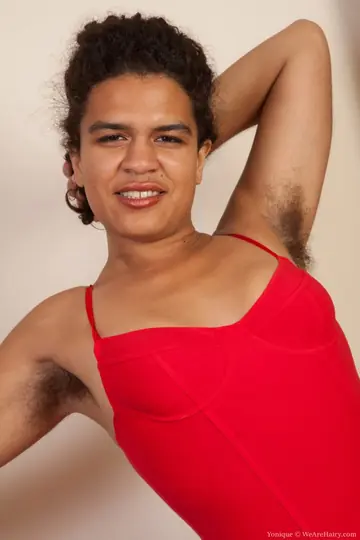 Yonique – Ebony Babe in Fishnet Stockings Shows Hairy Pits and Bush