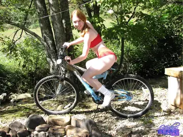 Nicki Blue – PAWG Redhead in a Bikini and Shorts Poses on a Bicycle Outdoors