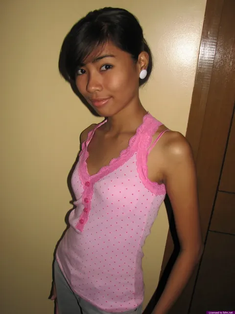 Skinny Asian Babe Strips Out of Her Jeans and Shows Her Shaved Pussy – photo 1 of 12