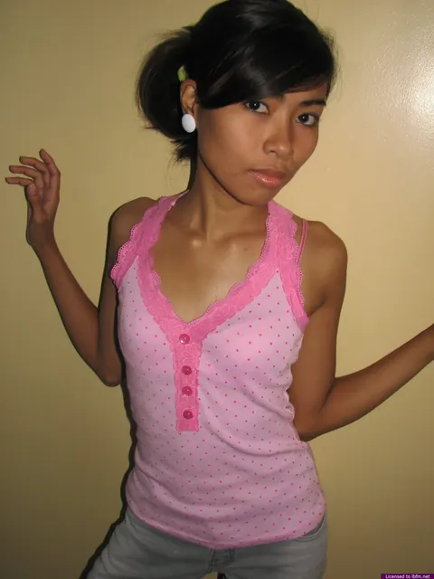 Skinny Asian Babe Strips Out of Her Jeans and Shows Her Shaved Pussy – photo 2 of 12