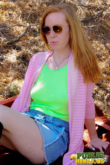 Kierra Wilde – Busty Redhead in Glasses Gives an Outdoor Handjob in Stockings and Shorts