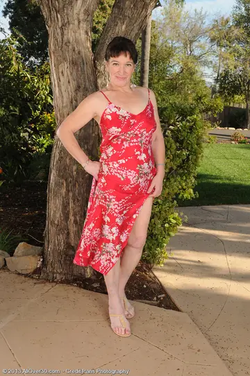Busty MILF Spreads Her Ass to Show Her Shaved Pussy Outdoors