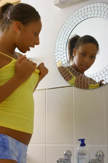 Amy Lou – Tall Ebony Brunette in Lingerie and Stockings Strips Nude