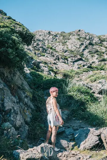 BBW with Short Hair and Tattoos Poses Clothed on the Beach