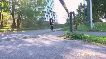 Czech Brunette in Heels and Boots Poses on the Street