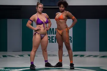Bella Rossi – Short-Haired Redhead and Curvy Ebony Woman in Bikinis Kiss, Lick, and Finger