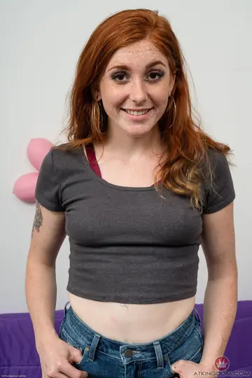 Redhead with Small Natural Tits Poses Nude