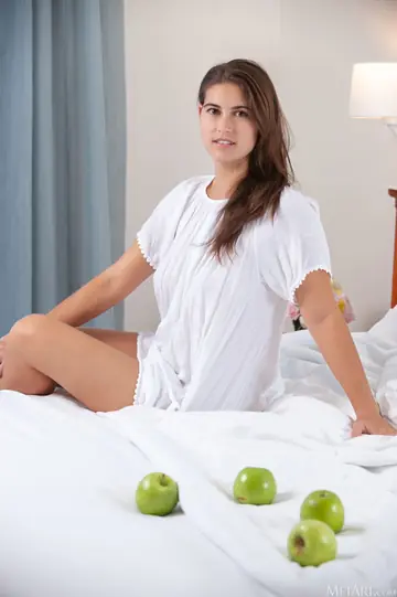 European Brunette Spreads Her Trimmed Pussy on the Bed