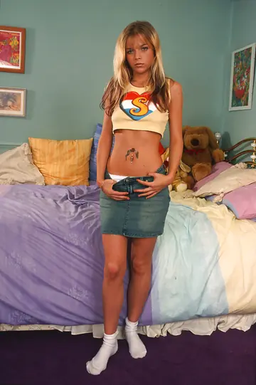 Blonde Peels Off Her Skirt and Masturbates with a Dildo