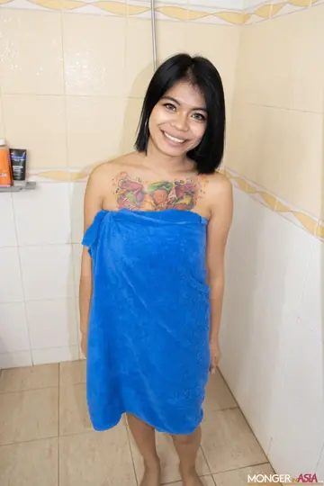 Asian Babe with Big Tits Bares Her Shaved Pussy in the Bathroom