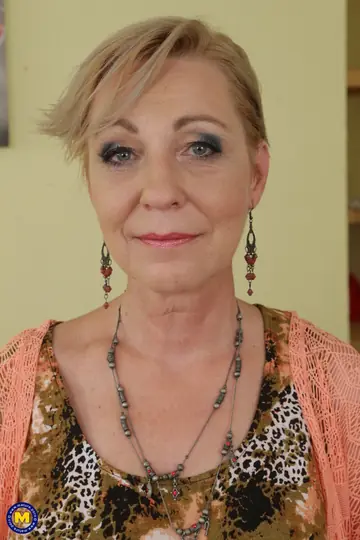 Mature European Blonde Masturbates in a Chair