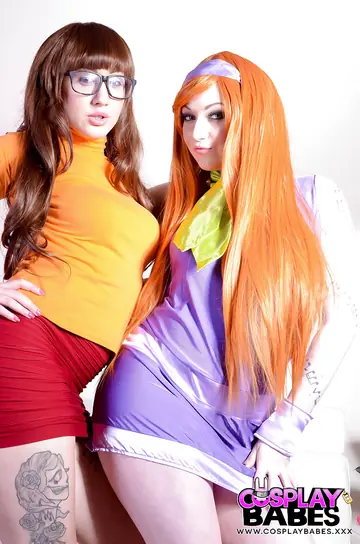 Harmony Reigns – Cosplay Lesbians in Costumes and Glasses Play with a Dildo