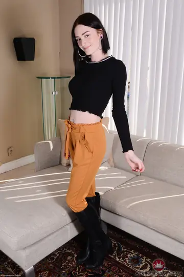 Slim Tattooed Brunette Strips Off Her Panties and Shows Her Shaved Pussy