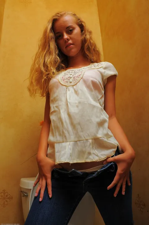 Jessie Rogers: Tanned Latina with Big Enhanced Tits Undresses and Pees on the Toilet – photo 4 of 20