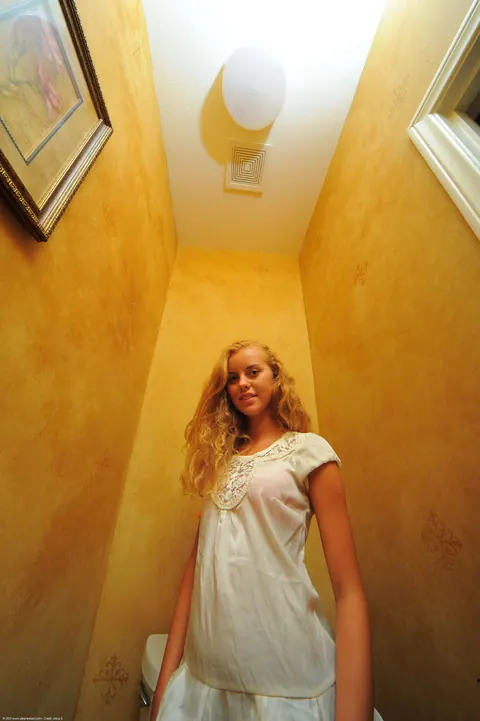 Jessie Rogers: Tanned Latina with Big Enhanced Tits Undresses and Pees on the Toilet – photo 2 of 20