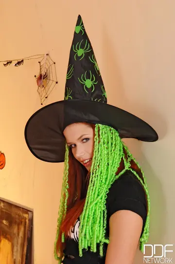 Redhead Strips Off Her Halloween Witch Costume to Bikini Then Spreads Nude