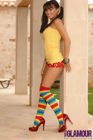 Brunette in Pigtails and Stockings Shows Off Her Big Fake Tits and Ass