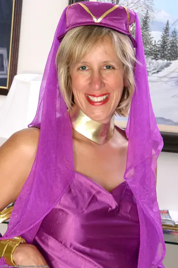 Mature Woman in a Skirt and Costume Lifts Hem and Spreads Wide