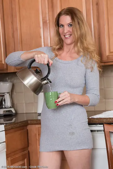 Mature Blonde PAWG in a Skirt Spreads Her Pussy in the Kitchen