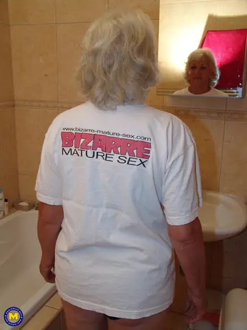 Blonde Granny Pisses in a Bucket and Toys Her Pussy in the Bathroom