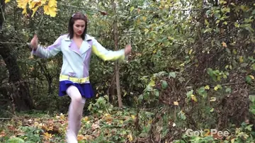 Brunette in Stockings Lifts Her Skirt and Pisses Near Ruins