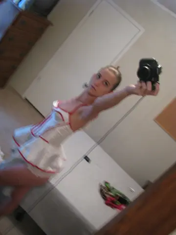Skinny Babe Lifts Her Dress for Mirror Selfie Showing Her Big Ass