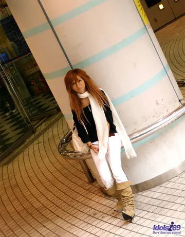 Japanese Redhead Peels Off Her Panties on a Hotel Bed
