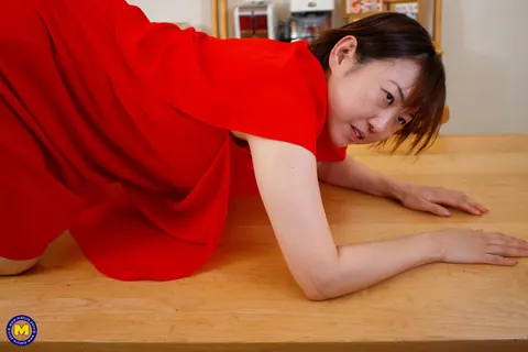 Yuki Kozakura: Mature Asian Woman Poses in a Red Dress and Flashes Her Panties – photo 15 of 20