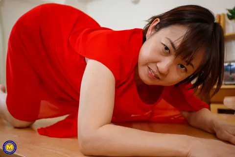 Yuki Kozakura: Mature Asian Woman Poses in a Red Dress and Flashes Her Panties – photo 16 of 20