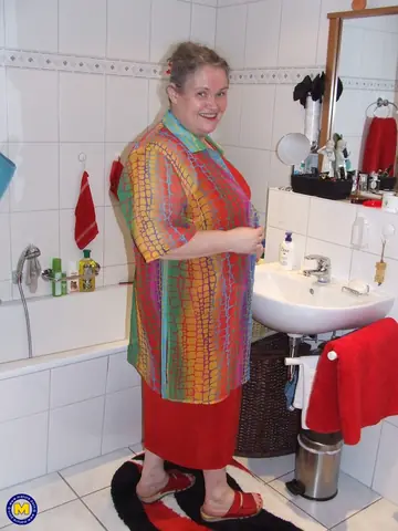 Birgid – Curvy European MILF Drops Her Skirt and Uses a Glass Toy in the Bathroom