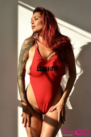 Tera Patrick – Tall Asian MILF Reveals Her Enhanced Tits from Red Bikini