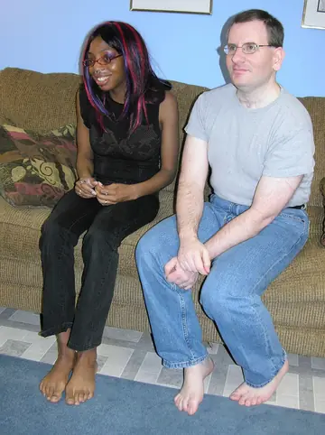 Ebony Redhead in Glasses Kisses Her Partner Before Interracial Sex