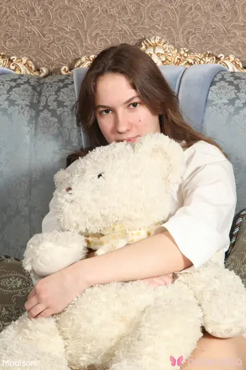Russian Brunette Undresses While Cuddling a Stuffed Bear