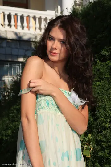 Brunette Strips Off Her Skirt on a Garden Path