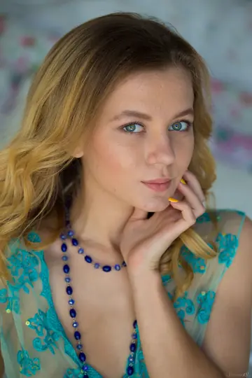 Woman Poses on a Day Bed in the Bedroom