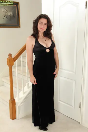 Mature Brunette with Big Tits Undresses and Spreads