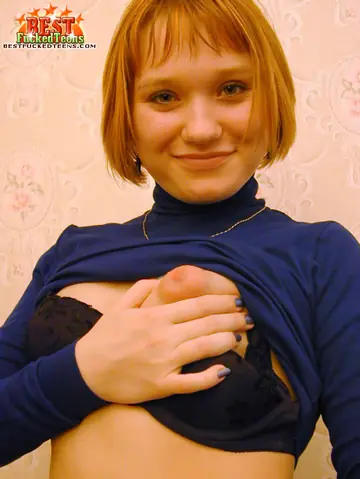 Redhead with Short Hair Stretches Her Hairy Pussy with a Dildo