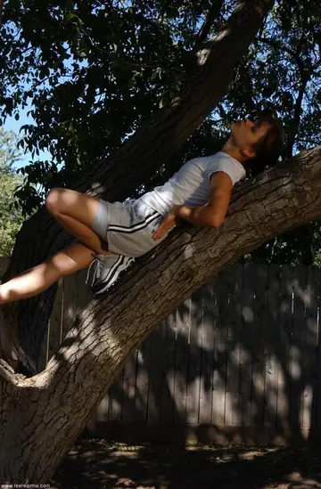 Petite Slim Woman Strips Out of Her Panties and Spreads in a Tree