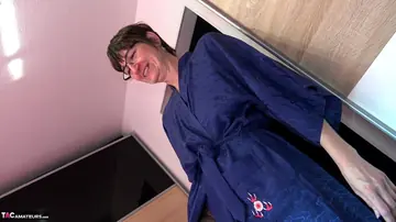MILF in Glasses Gives a Blowjob and Takes Cum in Mouth
